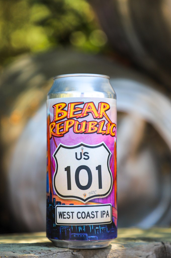 Colorful Bear Republic US 101 West Coast IPA can sitting on a wooden surface.